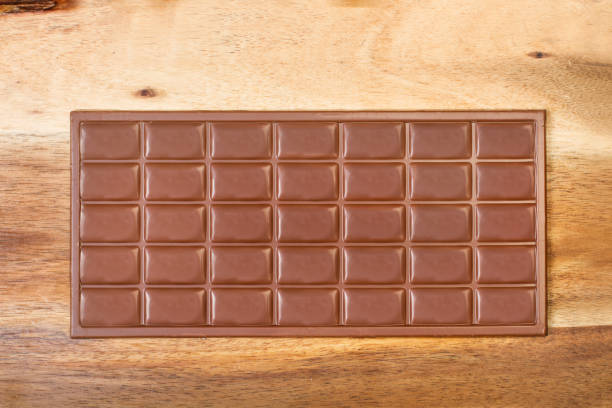 istock A chocolate bar on a wooden table 1212996531