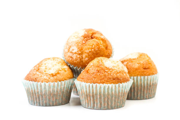 istock Vanilla and sugar cupcakes on a white background 1212996991