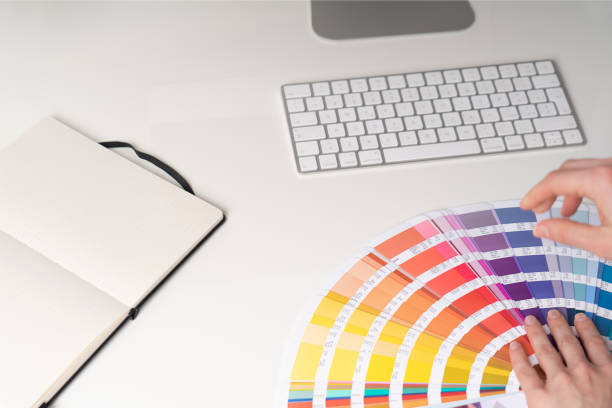 istock Desk with keyboard and rainbow palette 1212999526