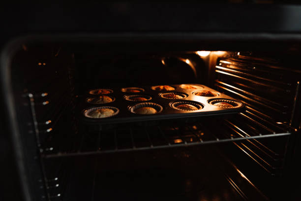istock Muffins in the oven 1212999944