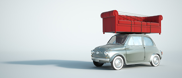 3D rendering of a small retro car carrying a big red sofa