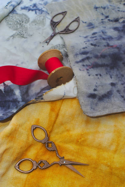 istock old sewing scissors on printed fabrics and red ribbon 1213001753