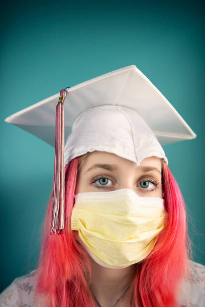 istock Graduate in Cap and Protective Face Mask 1213002672