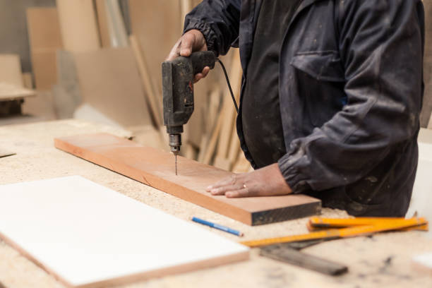 istock Carpenter working with wood in a lumberyard 1213002753