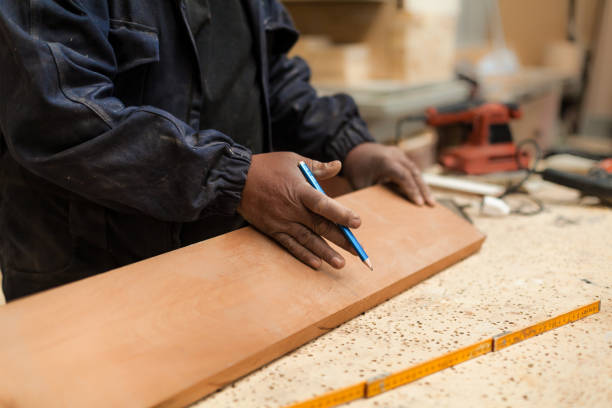 istock Carpenter working with wood in a lumberyard 1213002794