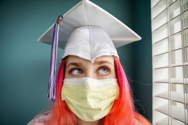 istock Female Graduate Wearing Protective Mask 1213003389