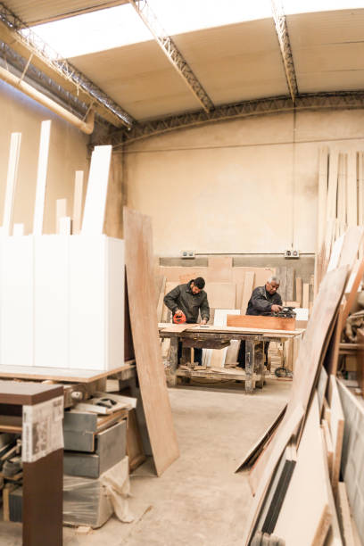 istock Carpenter working with wood in a lumberyard 1213003894