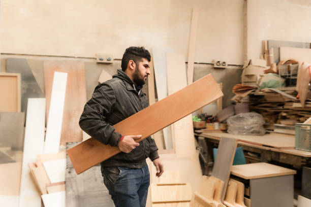 istock Carpenter working with wood in a lumberyard 1213004033