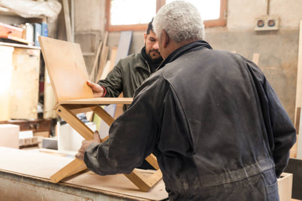 istock Carpenter working with wood in a lumberyard 1213004107