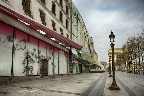 Paris 17 march 2020: Famous touristic spots like shopping avenue Champs Elysees, close to Arch of Triumph, usually crowded are deserted.