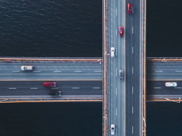 Aerial drone view of traffic intersecting bridges.  Composite image.
