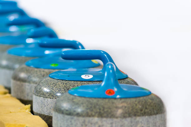 istock Sport Concepts. Closeup of Curling Blue Handle Stones on Ice.With Copyspace. Horizontal Image Composition 1213008657