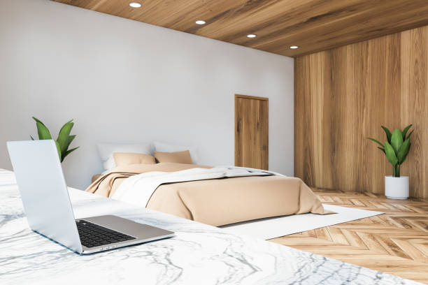 istock White and wooden master bedroom with home office 1213008882