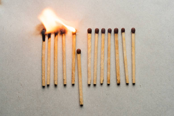istock stay home. quarantine concept. burnt and whole matches 1213012156