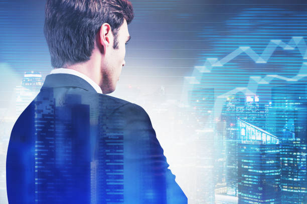 istock Investor looking at graph in night city sky 1213012286