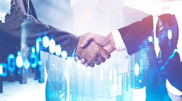 istock Handshake in city, financial graph 1213012627