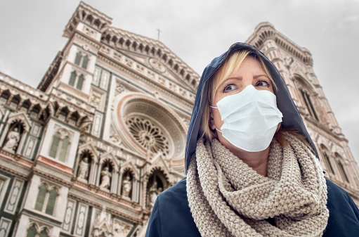 Young Woman Wearing Face Mask Walks the Streets In Tuscany, Florence, Italy