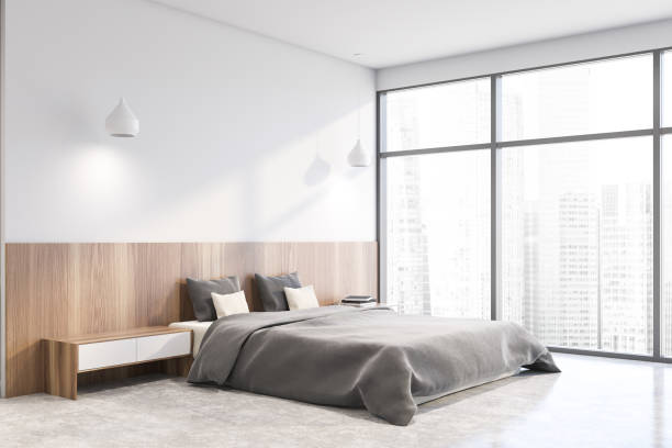istock White master bedroom corner with cityscape 1213014047