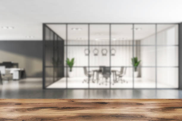 istock Table in blurry gray office meeting room 1213014376