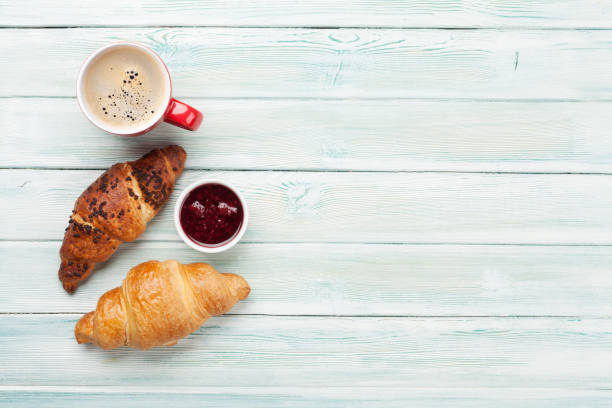 istock Breakfast with coffee and croissants 1213015213
