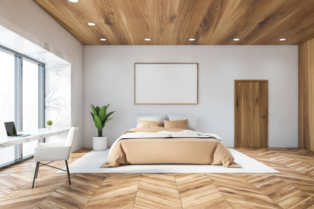 istock White bedroom with home office and poster 1213015475