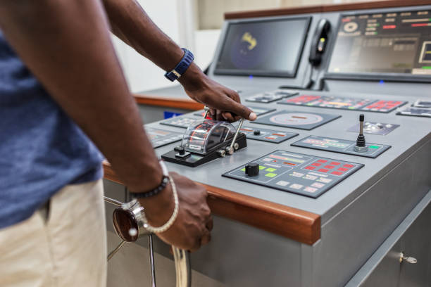 istock Captain's hands at the helm of a boat. 1213016565