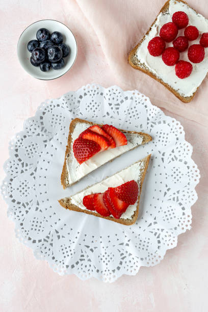 istock Toasted bread with fresh cheese and strawberries 1213018362