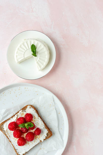 istock Toasted bread with fresh cheese and strawberries 1213018373