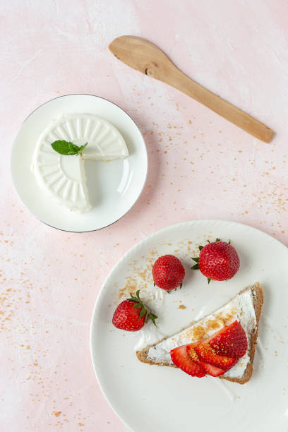 istock Toasted bread with fresh cheese and strawberries 1213018392