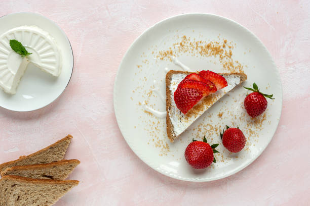 istock Toasted bread with fresh cheese and strawberries 1213018953