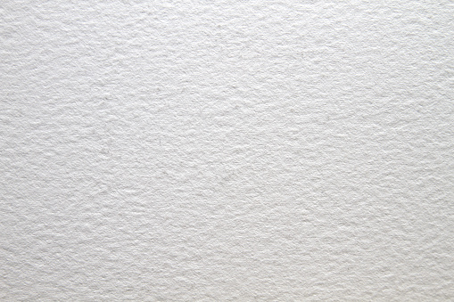 A simple square format close-up of watercolor paper with a soft texture pattern.