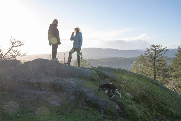 istock Female hikers pause on mountain ridge 1213020246