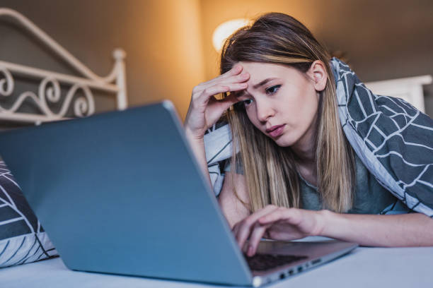 istock Young woman feeling sad using laptop 1213021296