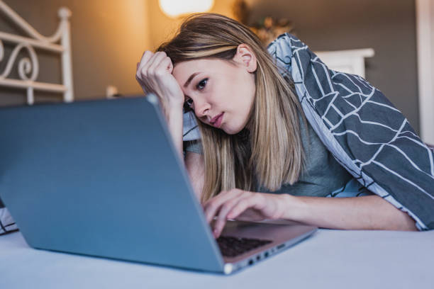 istock Young woman feeling sad using laptop 1213021460