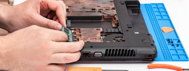 istock Engineer makes dismantling of RAM for disassembling and repairing a laptop. 1213021903