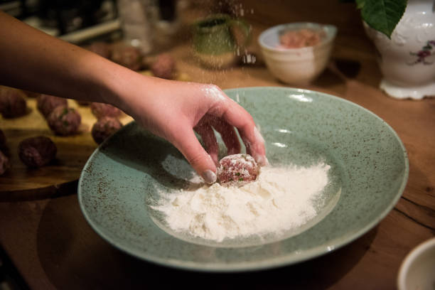 istock Rolling raw minced meat into meatballs. 1213025252