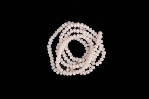 istock Natural stone beads on a black background isolated 1213027109
