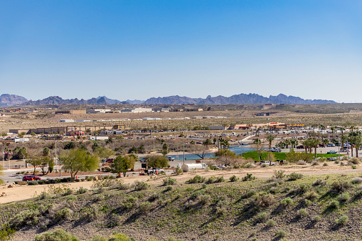 Laughlin, NV / USA – February 19, 2020: Business property view from Laughlin, Nevada, toward Bullhead City, Arizona, with the Colorado River in between as the state border.