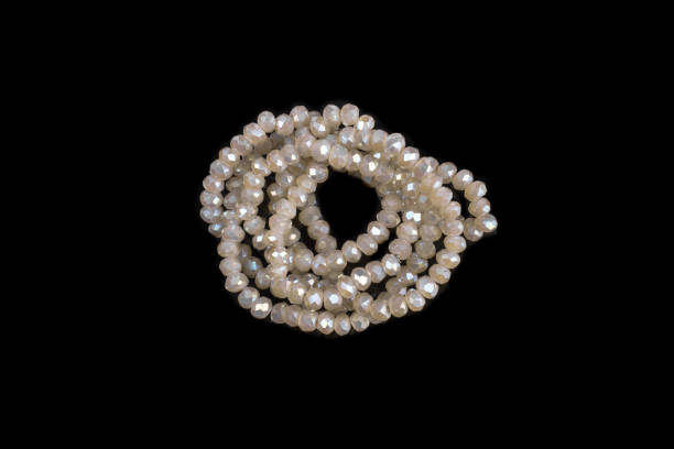 istock Natural stone beads on a black background isolated 1213027502