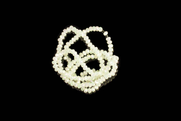 istock Natural stone beads on a black background isolated 1213027603