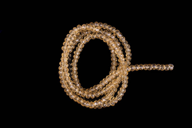 istock Natural stone beads on a black background isolated 1213027805