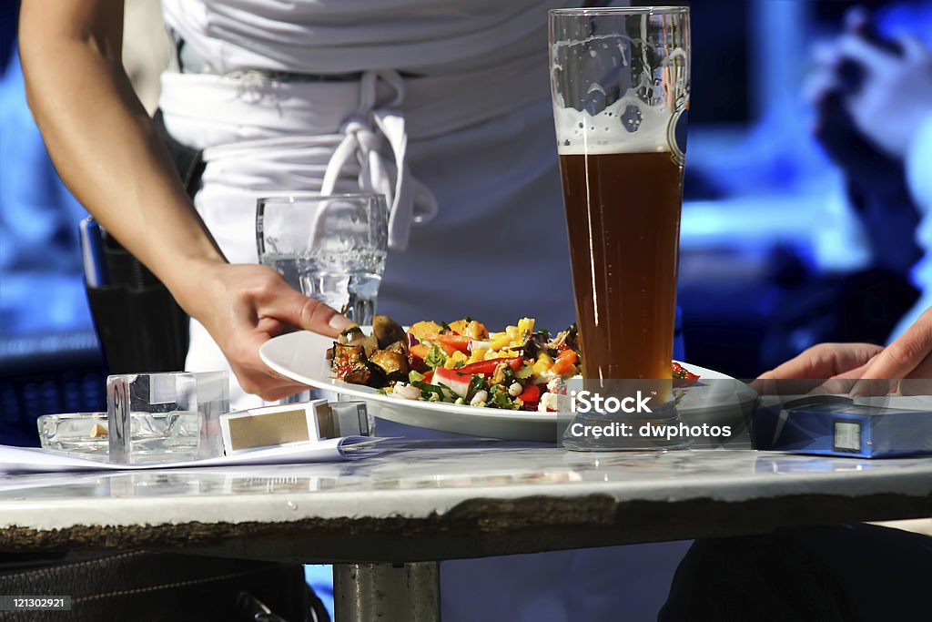 Waitress serving food  Adult Stock Photo