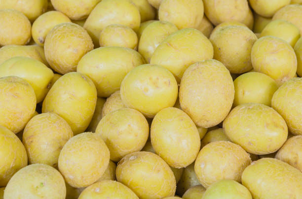 istock Organic yellow potatoes full frame view tuber crops background 1213030752
