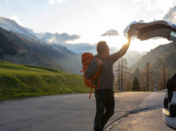 istock Male hiker prepares to leave vehicle 1213032004