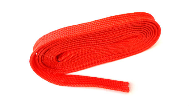 Twisted red elastic rubber bands isolated on white background