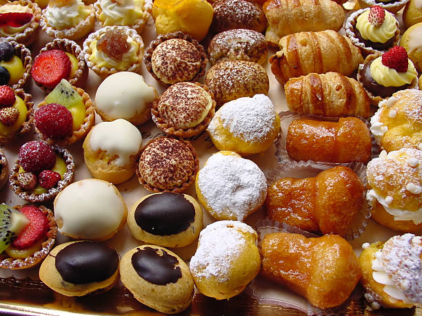 Close-up photo of delicious Italian pastries close-up of fresh italian pastries with cream and fruit dessert sweet food stock pictures, royalty-free photos & images
