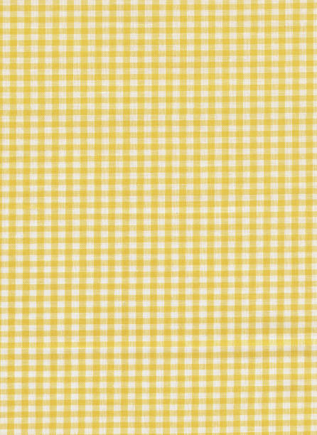 Checked fabric in yellow and white yellow and white checkered fabric useful as texture or backgrounds mustard yellow fabric stock pictures, royalty-free photos & images