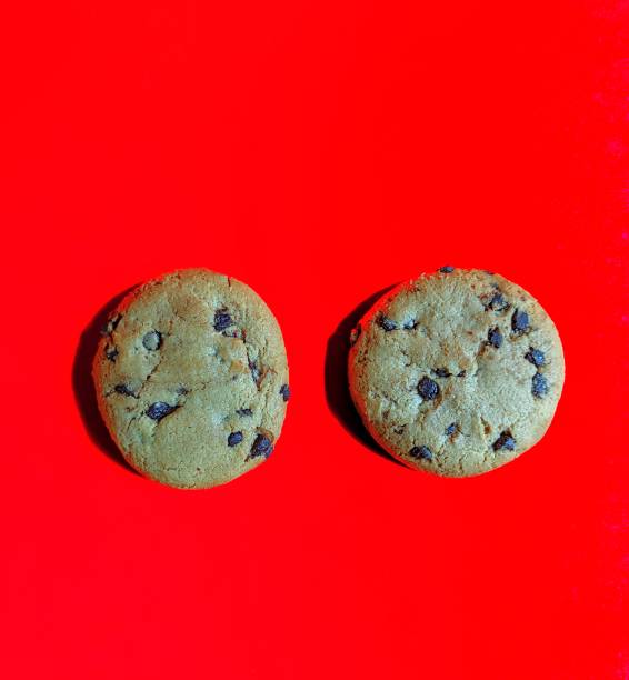 istock Chocolate chip cookies on red background. sweets concept 1213062026