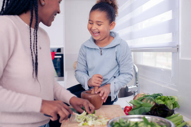 istock Mother and daughter spend quality time, cooking together. 1213063295