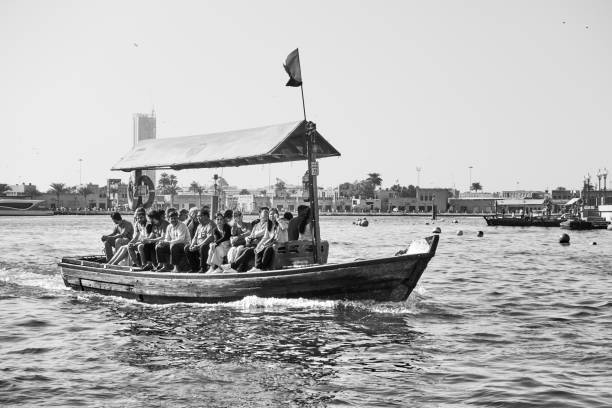 A shot of speeding water taxi sailing through Grand Canal, in emerald green water.
